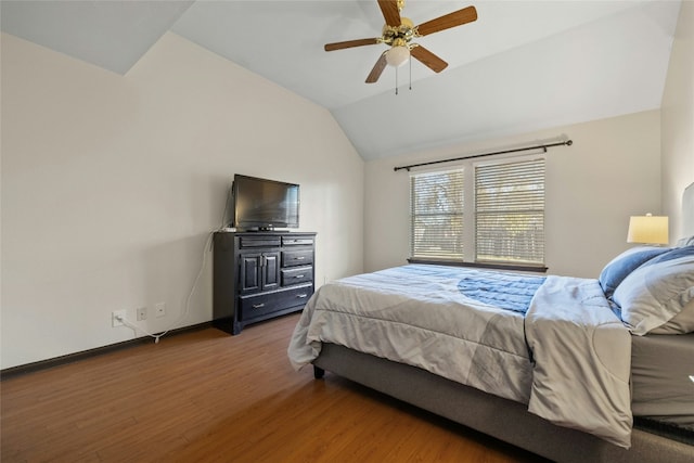 bedroom with hardwood / wood-style floors, ceiling fan, and lofted ceiling