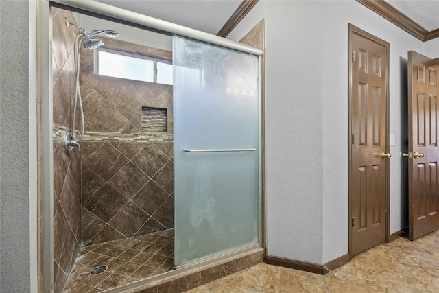 bathroom featuring an enclosed shower and ornamental molding