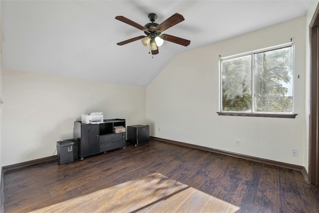 unfurnished office with vaulted ceiling, ceiling fan, and dark wood-type flooring