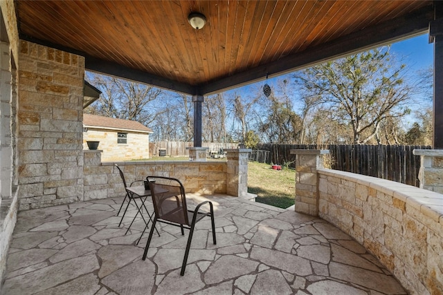 view of patio with exterior bar