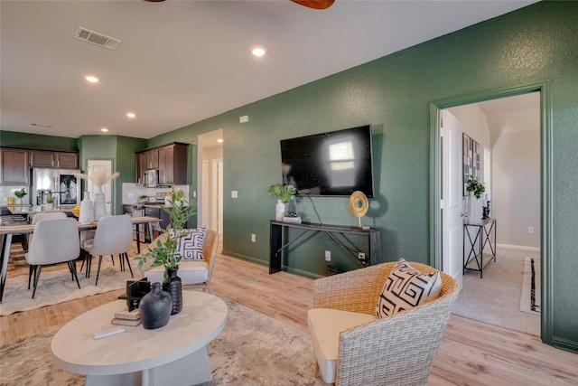 living room featuring light wood-type flooring