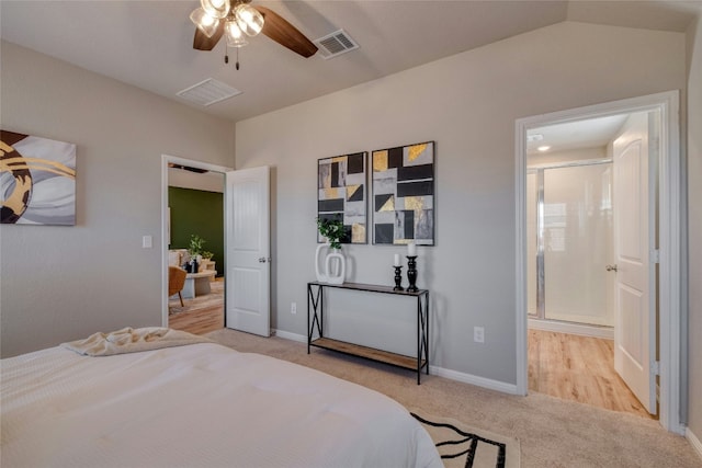 bedroom with ceiling fan, light colored carpet, and lofted ceiling