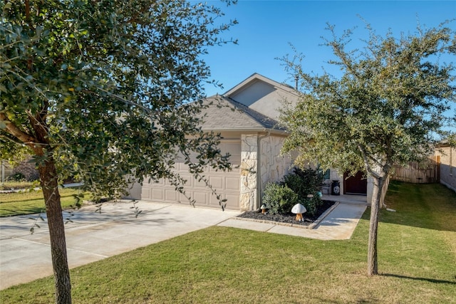 obstructed view of property featuring a front yard and a garage