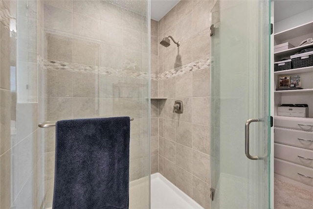 bathroom with a shower with shower door