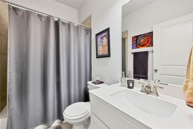 bathroom with vanity, a shower with curtain, and toilet