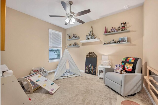 playroom featuring carpet flooring and ceiling fan