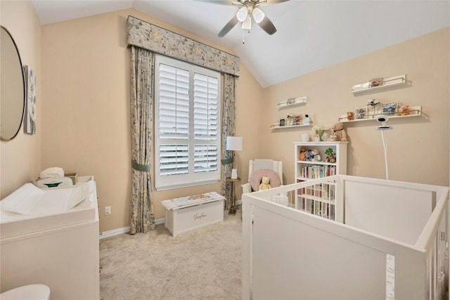 bedroom with vaulted ceiling and light carpet