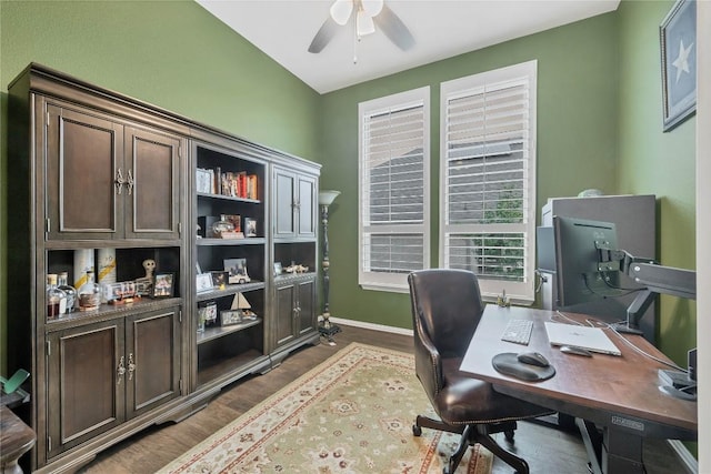 office area with dark wood-type flooring and ceiling fan