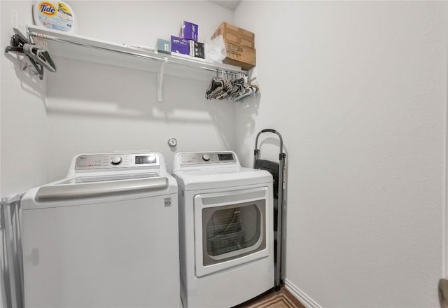 washroom featuring washing machine and dryer