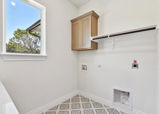 laundry room with hookup for an electric dryer, hookup for a gas dryer, cabinets, and hookup for a washing machine