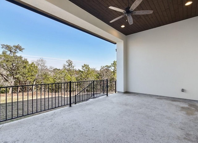 balcony featuring a patio area and ceiling fan