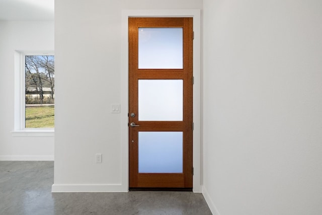 entrance foyer featuring concrete flooring