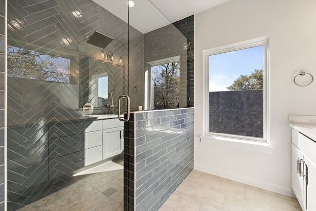 bathroom featuring tile patterned flooring, vanity, and an enclosed shower