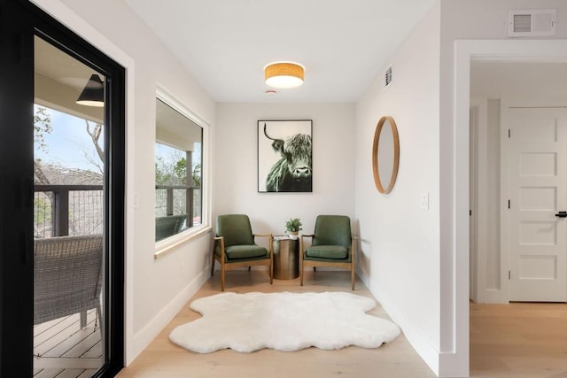 living area featuring light hardwood / wood-style floors