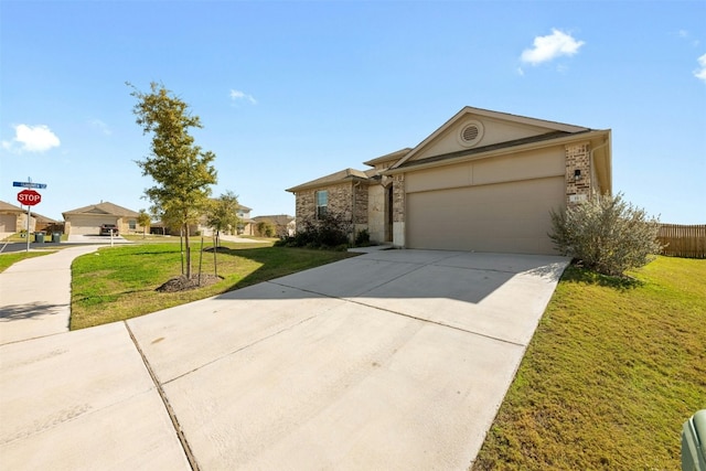 ranch-style home featuring a front yard and a garage