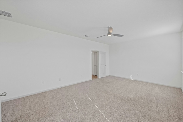 unfurnished room with light carpet and ceiling fan