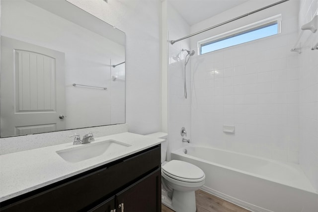 full bathroom with vanity, toilet, wood-type flooring, and shower / washtub combination