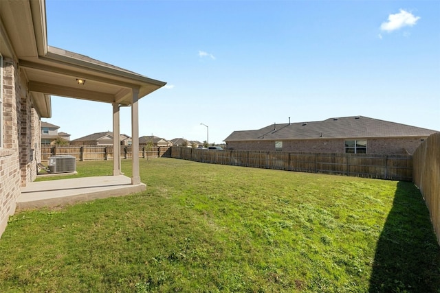 view of yard featuring a patio and central AC unit