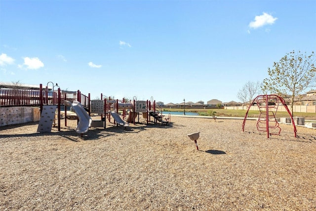 view of jungle gym featuring a water view