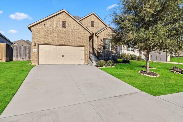 view of front of house featuring a garage and a front lawn