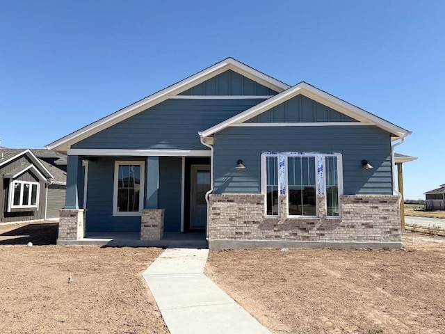 craftsman-style house with a porch and board and batten siding