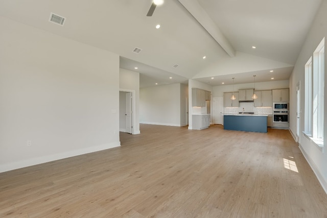 8504 Dongan Dr, Austin, TX 78744 - unfurnished living room featuring light wood-style flooring, recessed lighting, a ceiling fan, and baseboards