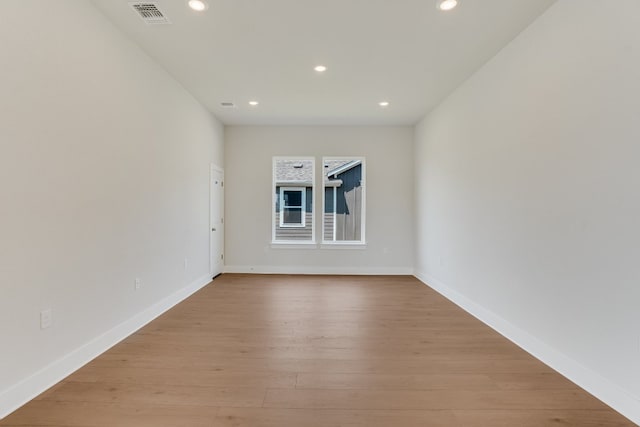 8504 Dongan Dr, Austin, TX 78744 - empty room with recessed lighting, light wood finished floors, and baseboards