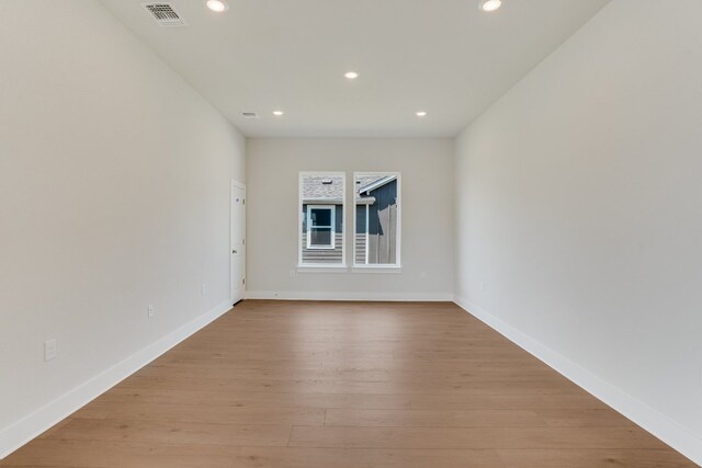 8504 Dongan Dr, Austin, TX 78744 - spare room featuring recessed lighting and light wood-style floors