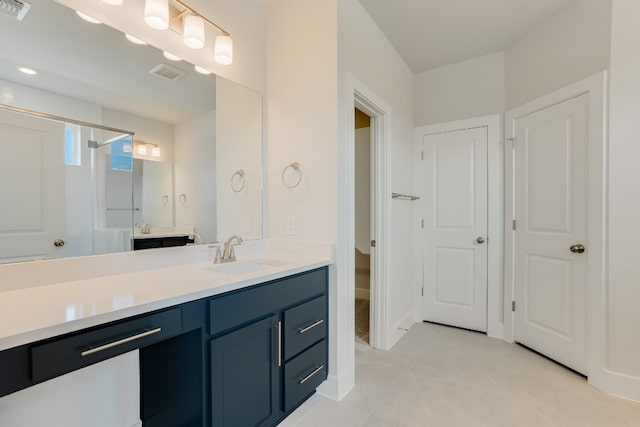 8504 Dongan Dr, Austin, TX 78744 - bathroom featuring vanity, a stall shower, and tile patterned flooring