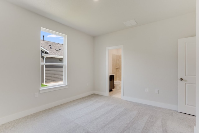 8504 Dongan Dr, Austin, TX 78744 - unfurnished bedroom featuring light colored carpet and connected bathroom
