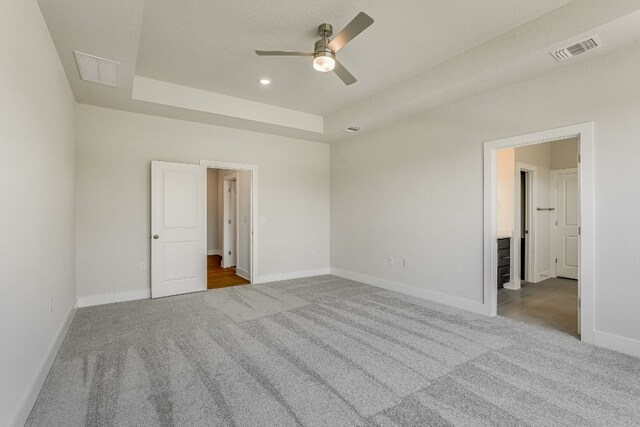 8504 Dongan Dr, Austin, TX 78744 - unfurnished bedroom featuring carpet floors, a raised ceiling, and recessed lighting