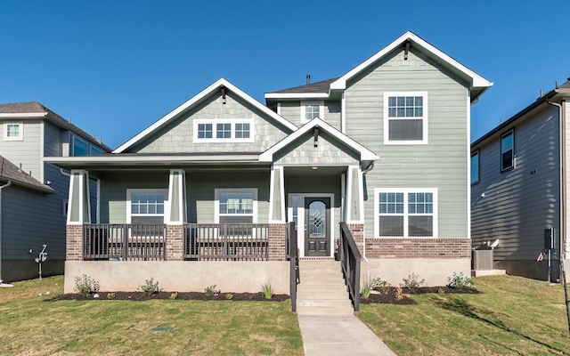 craftsman-style home with a porch and a front yard