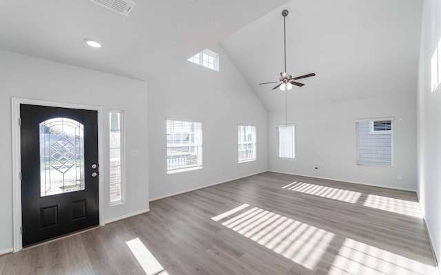 entrance foyer featuring ceiling fan, high vaulted ceiling, and light hardwood / wood-style flooring