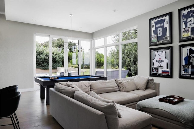 living room featuring pool table, an inviting chandelier, and hardwood / wood-style flooring