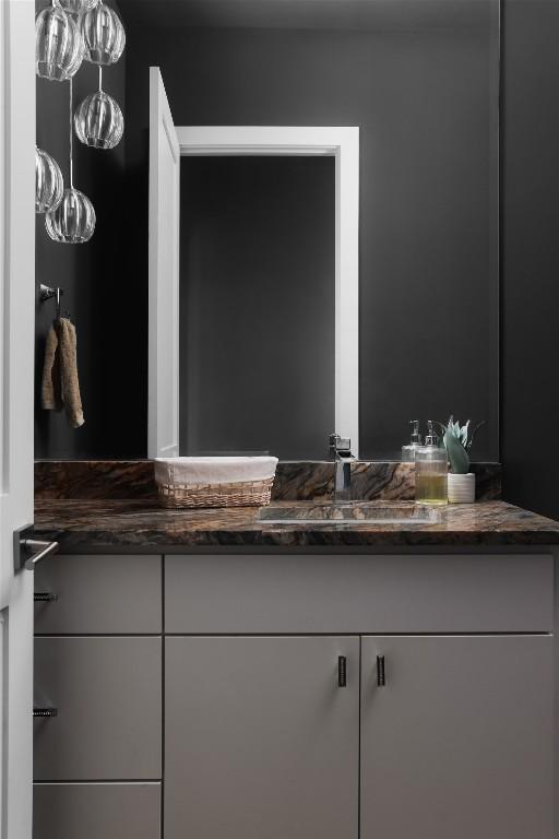 bathroom featuring vanity and an inviting chandelier