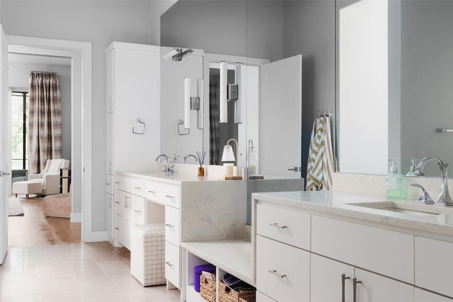 bathroom featuring tile patterned flooring and vanity