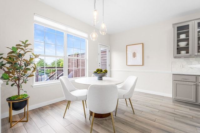 dining area with light hardwood / wood-style flooring