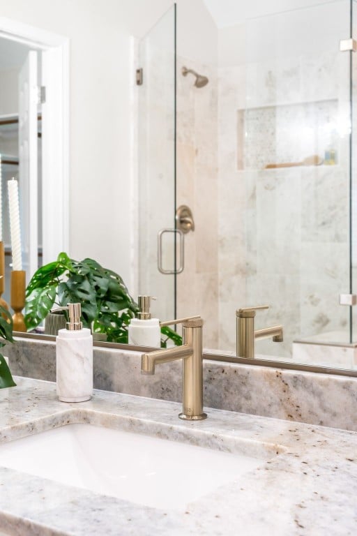 bathroom with vanity and an enclosed shower