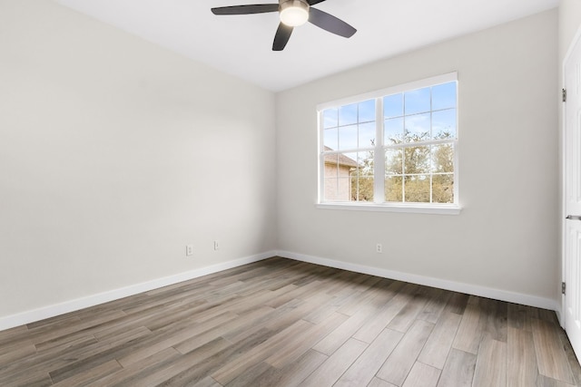 unfurnished room with light hardwood / wood-style flooring and ceiling fan