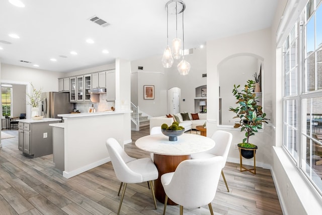 dining room featuring hardwood / wood-style flooring and plenty of natural light