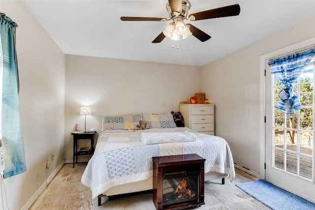 bedroom featuring access to outside and ceiling fan