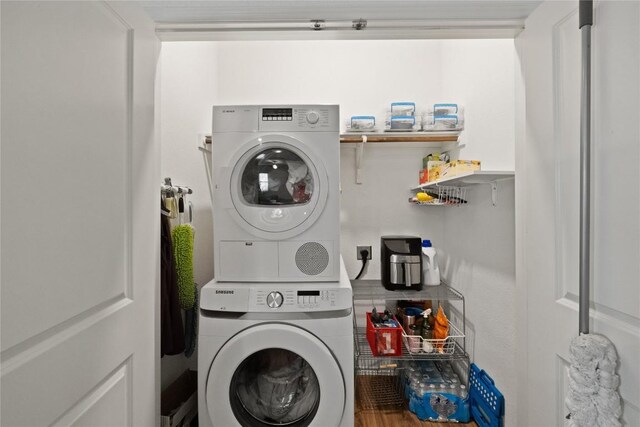 laundry room featuring stacked washing maching and dryer