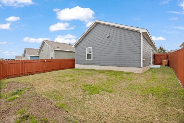 rear view of property with a yard
