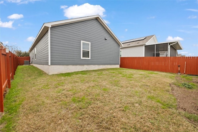 rear view of property with a yard