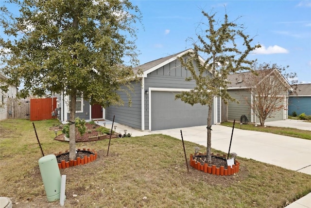 view of front of home with a garage and a front yard