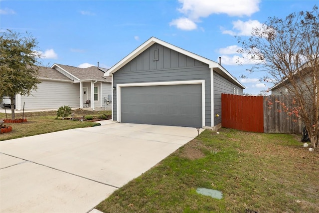 view of front of property with a garage and a front yard