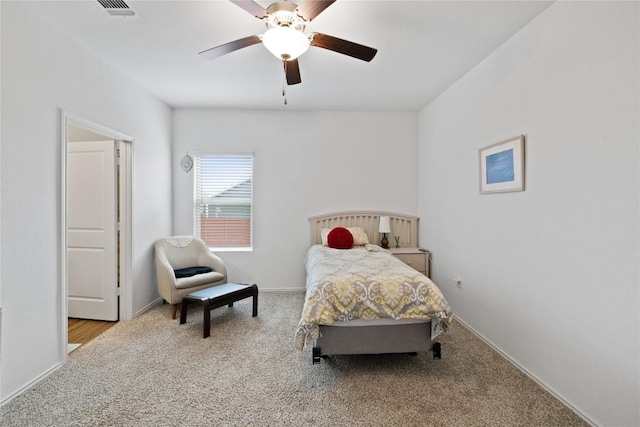 bedroom featuring ceiling fan and light carpet