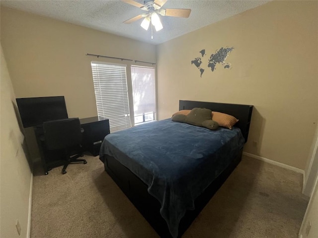 bedroom featuring carpet, a textured ceiling, and ceiling fan