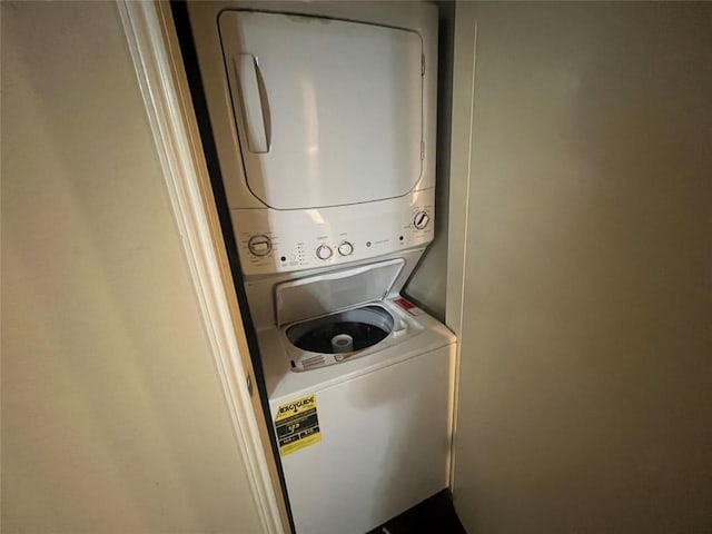 laundry room featuring stacked washer and clothes dryer