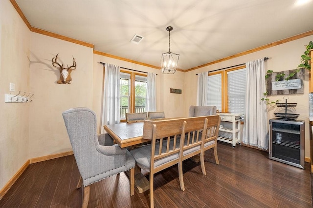 dining room featuring crown molding, dark wood-type flooring, and a notable chandelier